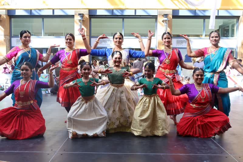 Students performing an outdoor group dance