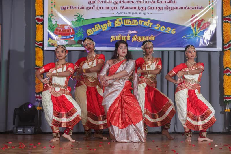 Children performing in bright costumes at a festival