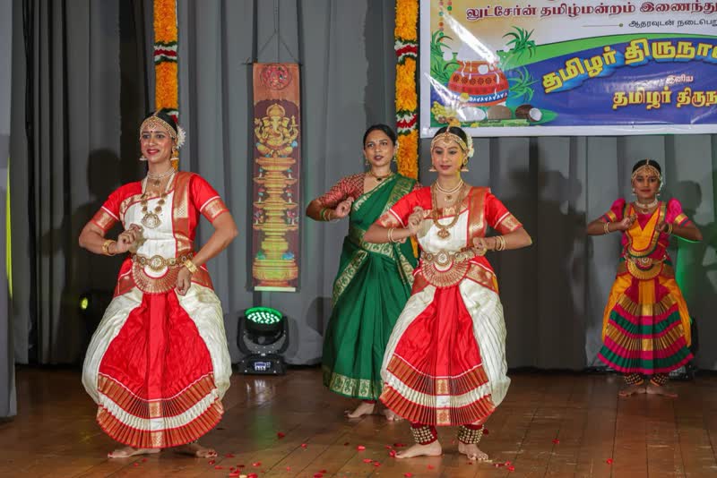 Students in costume performing at a cultural celebration