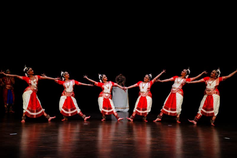 A line of dancers on stage