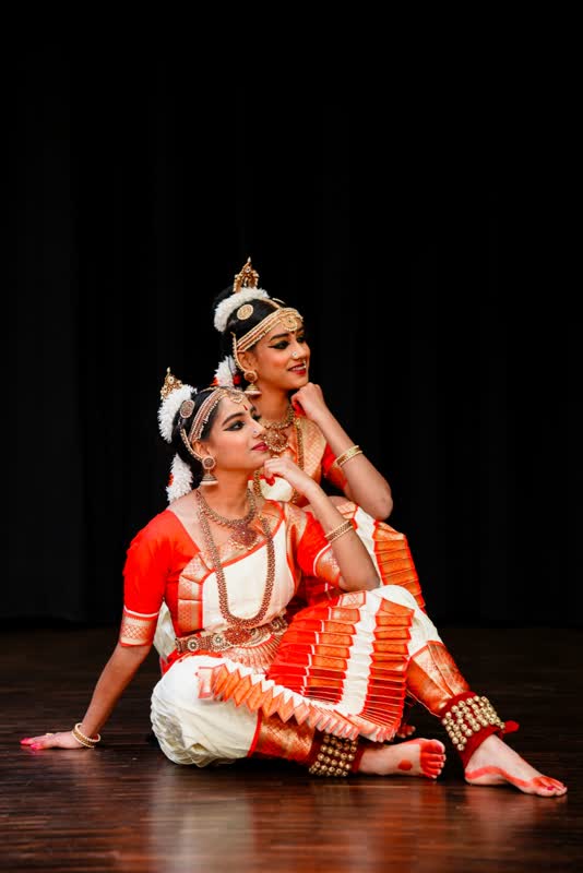 Two dancers in a classical duet pose