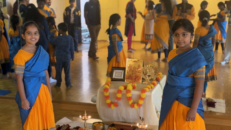 Pooja altar with marigold garlands and lamps