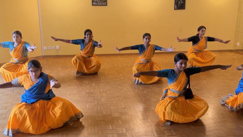 Dancers in a deep classical pose